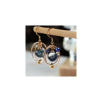 WEWDBY Handmade Cosmic Planet Art Earrings - Iridescent Hand-Mixed Resin Planet Design, 3D Metal Ring Surrounding, Lightweight & Hypoallergenic, Creative Jewelry for Women, Unique Gift for Sci-Fi & Art Enthusiasts